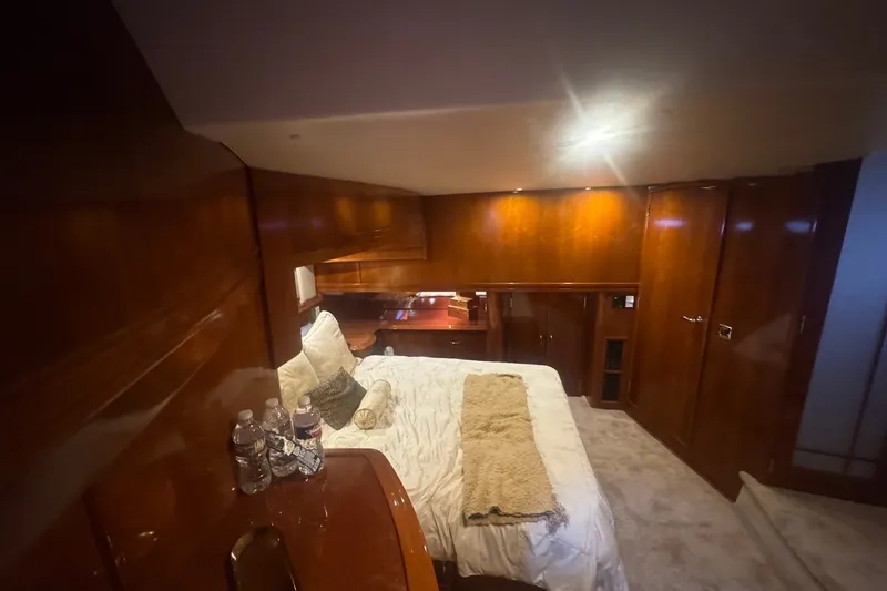 Slide: The Image of Luxurious cabin interior of 2003 Carver 570 Voyager Pilothouse yacht with cozy bedding. - 21