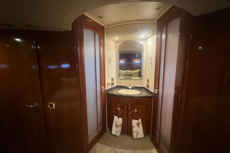 Slide: The Image of Luxurious bathroom interior of 2003 Carver 570 Voyager Pilothouse yacht with elegant wood finishes. - 22