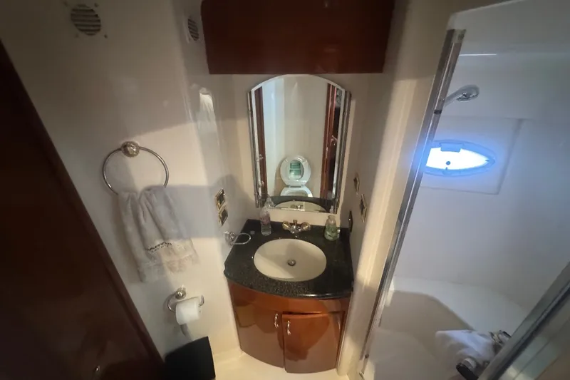 Slide: The Image of Luxurious bathroom in 2003 Carver 570 Voyager Pilothouse yacht with sink and mirror. - 27