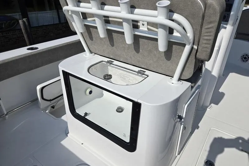 Slide: The Image of 2026 Sea Hunt Gamefish 25 boat interior with rod holders and storage compartment. - 21