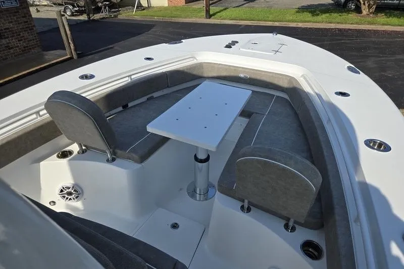 Slide: The Image of 2026 Sea Hunt Gamefish 25 boat interior with seating and table setup. - 23