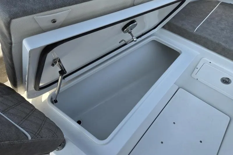Slide: The Image of Open storage compartment on a 2026 Sea Hunt Gamefish 25 boat. - 26