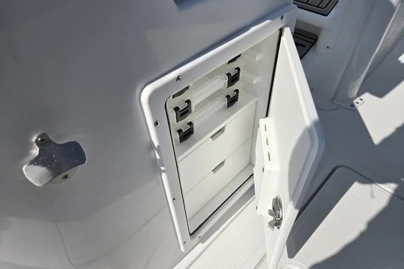 Slide: The Image of Open storage compartment on 2026 Sea Hunt Gamefish 25 boat. - 25