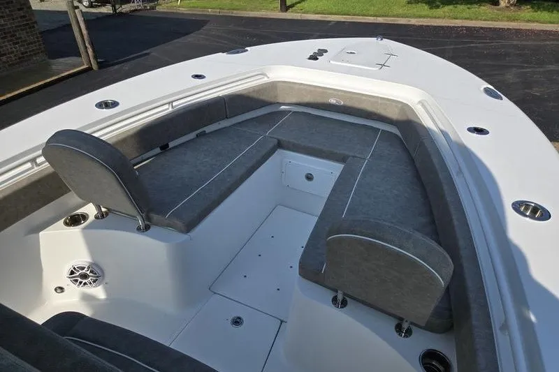 Slide: The Image of 2026 Sea Hunt Gamefish 25 boat interior with cushioned seating and storage compartments. - 28