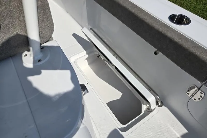 Slide: The Image of 2026 Sea Hunt Gamefish 25 boat interior with open storage compartment. - 17