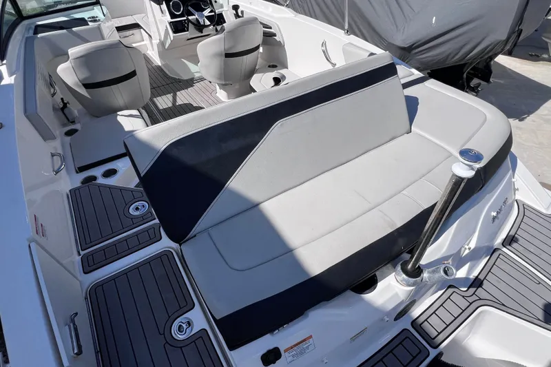 Slide: The Image of 2022 Sea Ray SPX 210 Outboard boat interior with seating and deck details. - 13