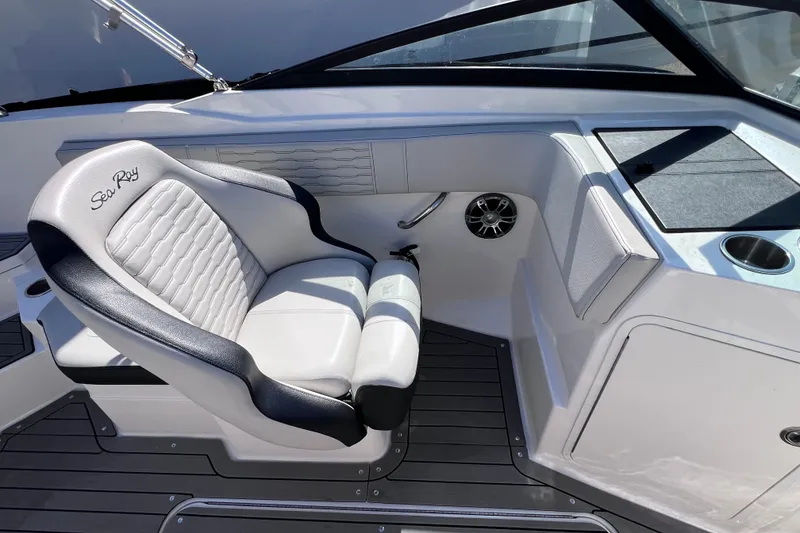 Slide: The Image of 2022 Sea Ray SPX 210 Outboard interior with luxurious seating and sleek design. - 17