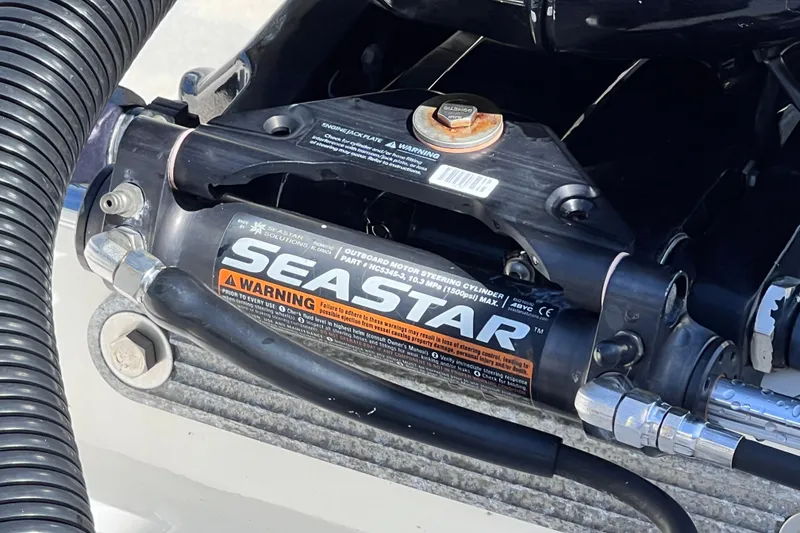 Slide: The Image of Close-up of SeaStar steering cylinder on 2022 Sea Ray SPX 210 Outboard boat. - 36