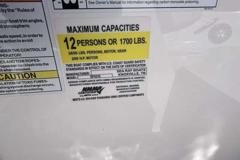 Slide: The Image of 2022 Sea Ray SPX 210 Outboard capacity label: 12 persons or 1700 lbs, 209 HP motor. - 25