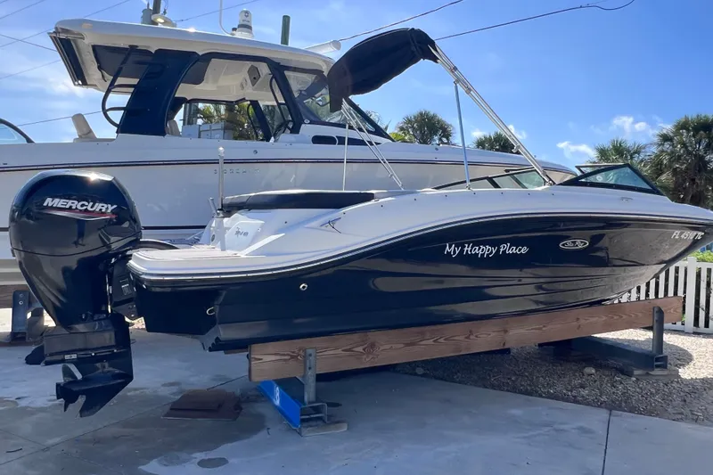 The Image of 2022 Sea Ray SPX 210 Outboard boat on display with Mercury engine. - 0
