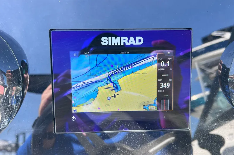 Slide: The Image of Simrad navigation display on 2022 Sea Ray SPX 210 Outboard boat dashboard. - 34