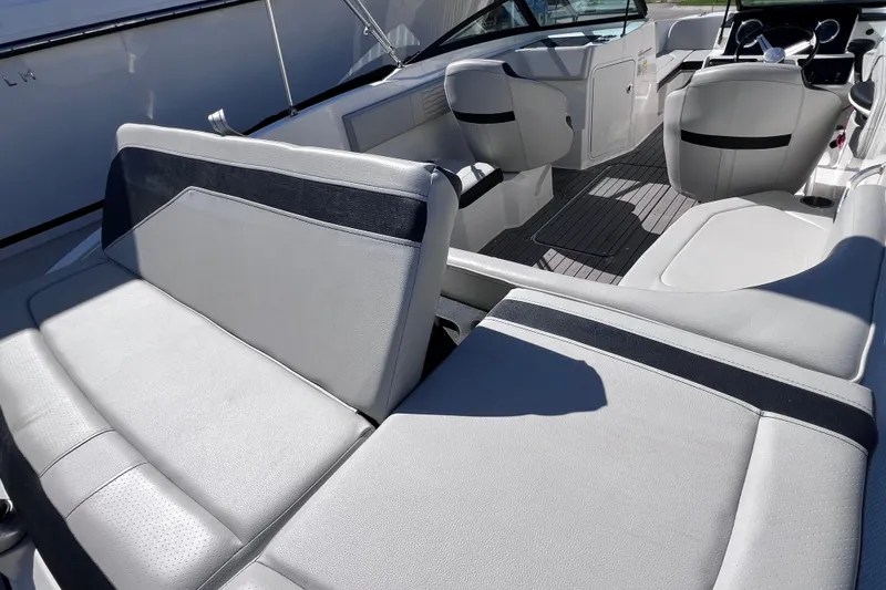 Slide: The Image of 2022 Sea Ray SPX 210 Outboard interior with sleek seating and modern design. - 14