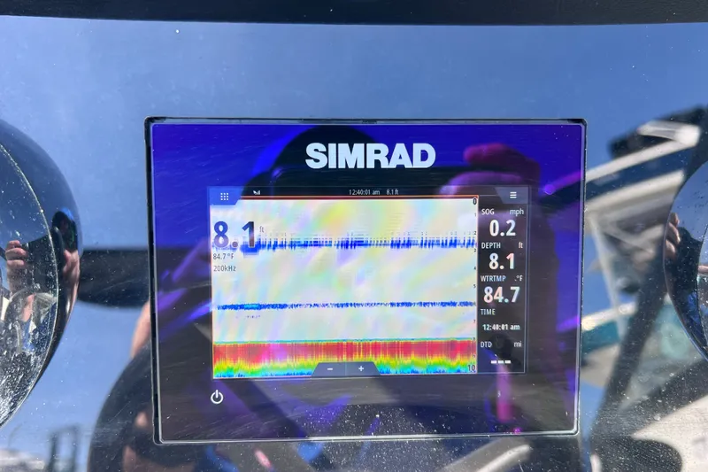 Slide: The Image of Simrad display on 2022 Sea Ray SPX 210 Outboard showing depth and water temperature. - 35