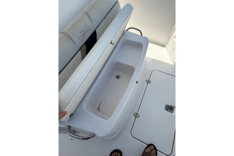 Slide: The Image of Open storage compartment on a 2010 Donzi 32 ZF boat deck. - 19