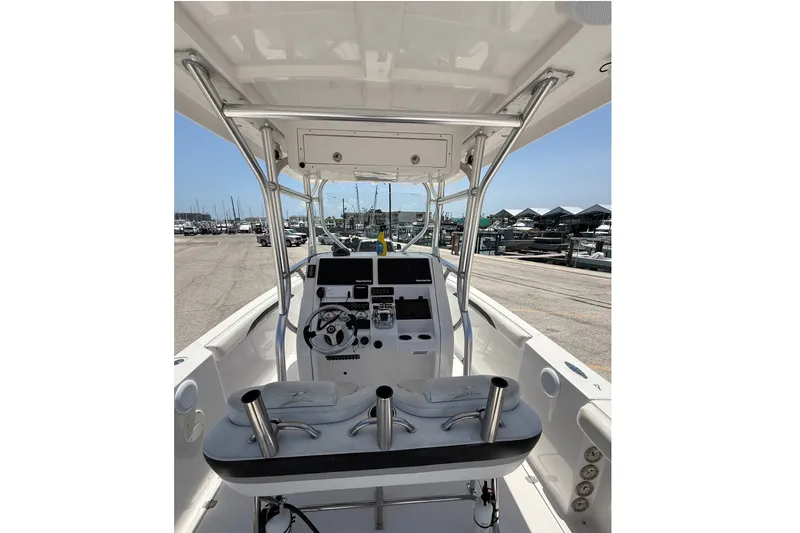 Slide: The Image of 2010 Donzi 32 ZF boat interior with steering console and seating at marina. - 6