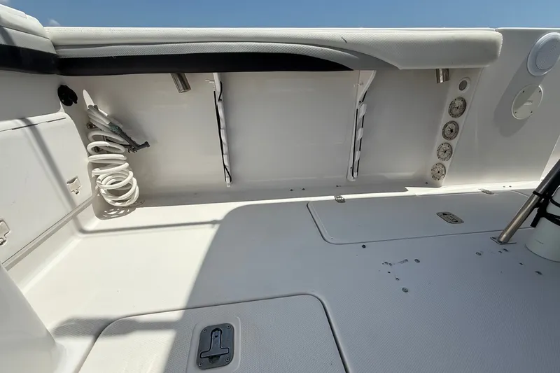 Slide: The Image of Interior view of a 2010 Donzi 32 ZF boat, featuring storage and control panels. - 9
