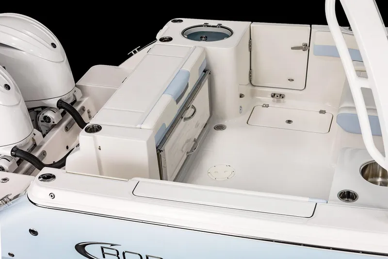 Slide: The Image of Manufacturer Provided Image: 2025 Robalo R257 Dual Console boat interior with storage and seating features. - 8