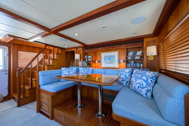 Slide: The Image of Luxurious interior of 2008 Outer Reef Yachts 800 Motoryacht with elegant wood and blue seating. - 13