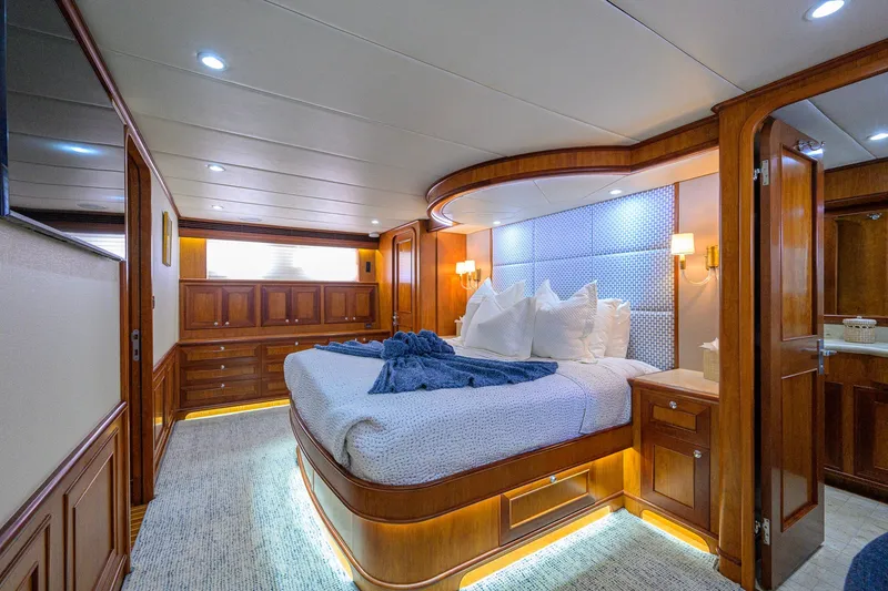 Slide: The Image of Luxurious bedroom interior of 2008 Outer Reef Yachts 800 Motoryacht with elegant wood finishes. - 22