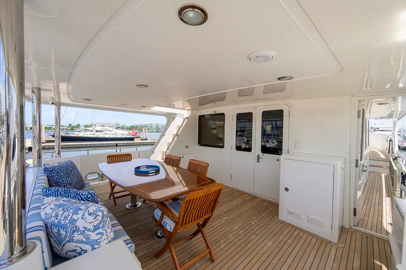 Slide: The Image of Spacious deck of 2008 Outer Reef Yachts 800 Motoryacht with elegant seating and dining area. - 31