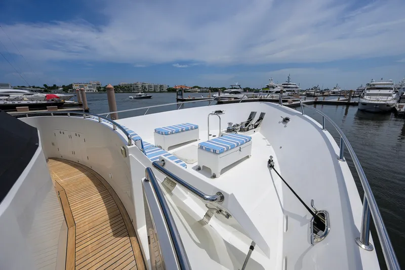 Slide: The Image of 2008 Outer Reef Yachts 800 Motoryacht deck with seating, docked in a marina. - 41
