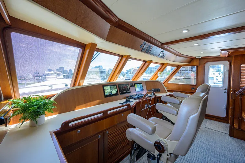 Slide: The Image of Luxurious helm of 2008 Outer Reef Yachts 800 Motoryacht with leather seats and navigation equipment. - 16