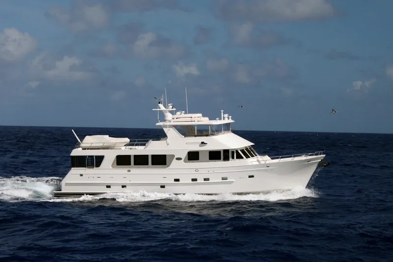The Image of 2008 Outer Reef Yachts 800 Motoryacht cruising on open sea under clear skies. - 1