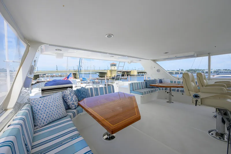 Slide: The Image of Luxurious 2008 Outer Reef Yachts 800 Motoryacht interior with striped seating and wooden table. - 39