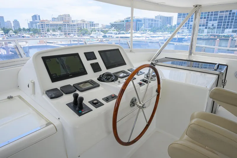 Slide: The Image of Helm of 2008 Outer Reef Yachts 800 Motoryacht with modern navigation equipment and city marina view. - 40