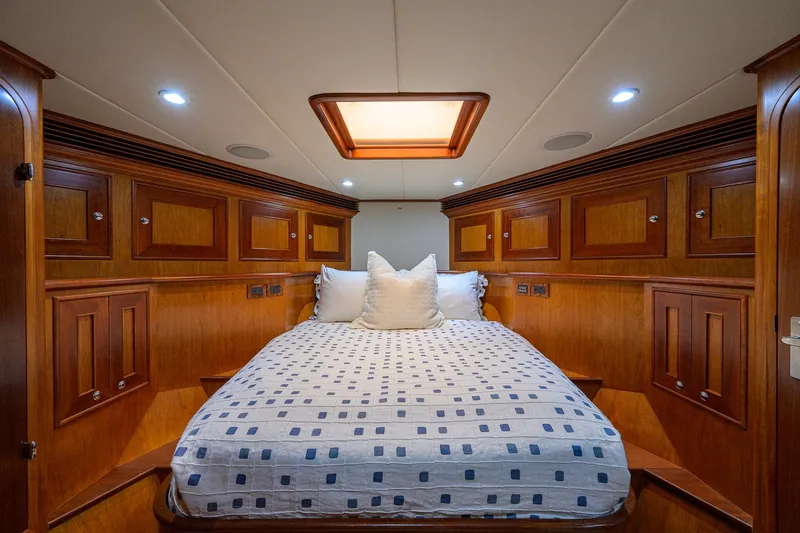 Slide: The Image of Luxurious cabin interior of 2008 Outer Reef Yachts 800 Motoryacht with wood paneling and cozy bedding. - 18