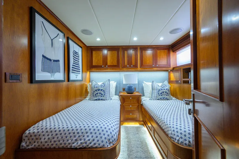 Slide: The Image of Luxurious twin cabin in 2008 Outer Reef Yachts 800 Motoryacht, featuring elegant wood finishes. - 27