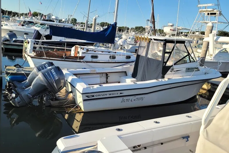 Slide: The Image of 1985 Grady-White Offshore Pro 247 boat docked in marina with Yamaha outboard motor. - 7