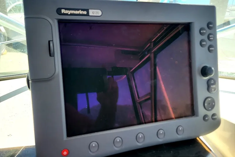 Slide: The Image of Raymarine C120 display on 1985 Grady-White Offshore Pro 247 boat dashboard. - 4