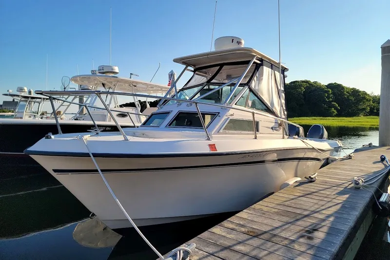 The Image of 1985 Grady-White Offshore Pro 247 boat docked on a sunny day. - 0