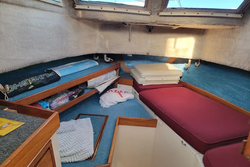 Slide: The Image of Interior cabin of 1985 Grady-White Offshore Pro 247 boat with storage and seating. - 5