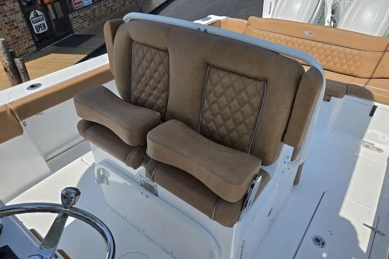 Slide: The Image of Luxurious seating on 2027 Sea Hunt Ultra 275SE boat with diamond-stitched upholstery. - 11