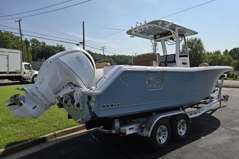 Slide: The Image of 2027 Sea Hunt Ultra 275SE boat on trailer, featuring Yamaha outboard motor. - 3