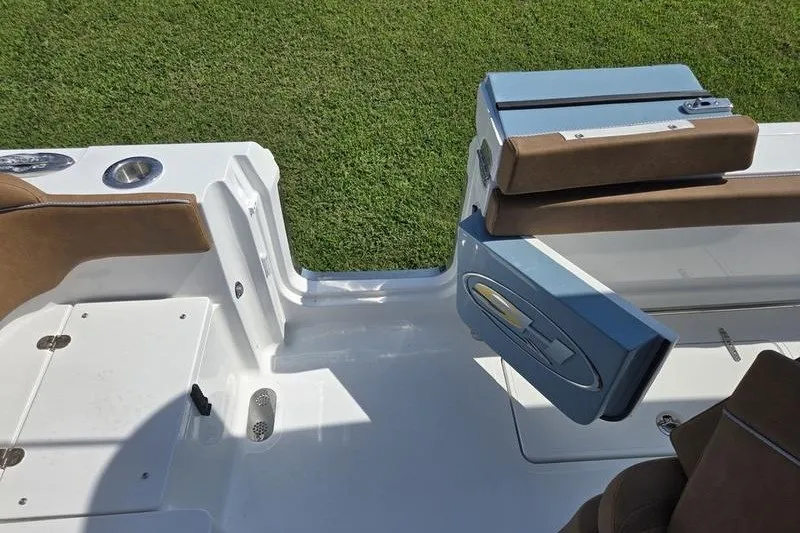 Slide: The Image of 2027 Sea Hunt Ultra 275SE boat interior with seating and storage compartments. - 12