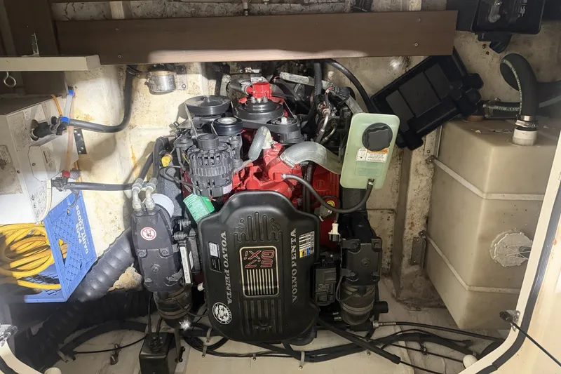Slide: The Image of Engine compartment of a 2006 Larson Cabrio 260 boat, featuring a Volvo Penta engine. - 35