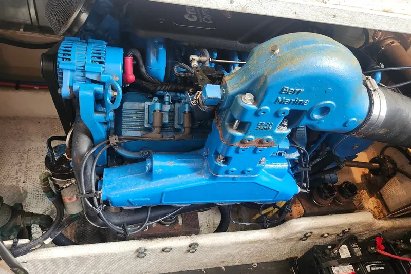 Slide: The Image of Engine compartment of a 2008 Silverton 36 Convertible boat, featuring a blue marine engine. - 31