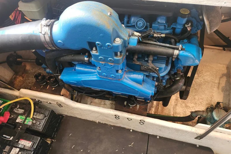 Slide: The Image of Engine compartment of a 2008 Silverton 36 Convertible boat, featuring a blue marine engine. - 33