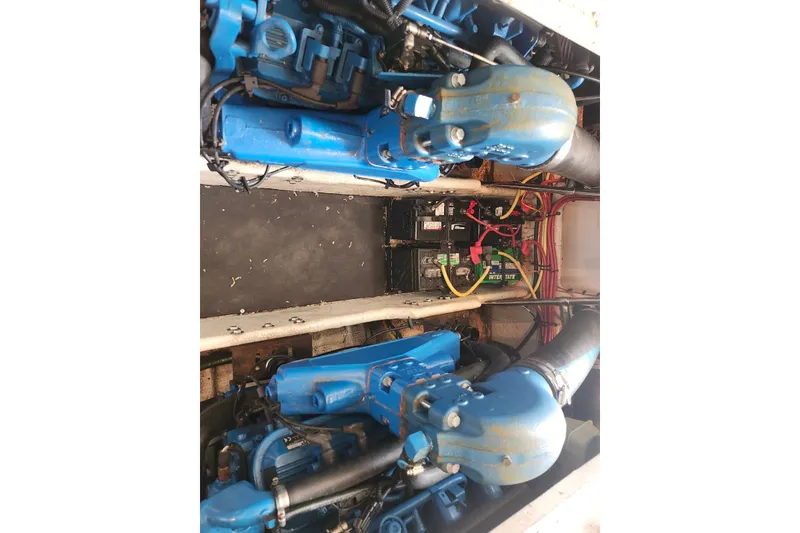 Slide: The Image of Engine compartment of a 2008 Silverton 36 Convertible boat with visible blue components. - 32