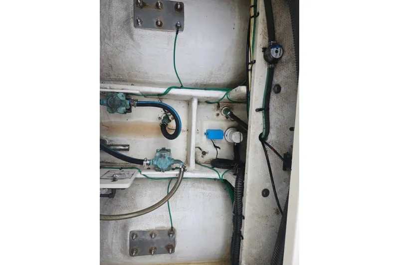 Slide: The Image of Engine compartment of a 2008 Silverton 36 Convertible boat, showing hoses and fittings. - 34