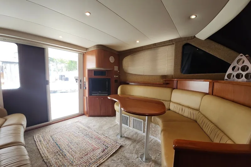 Slide: The Image of Luxurious interior of 2008 Silverton 36 Convertible yacht with plush seating and entertainment area. - 21