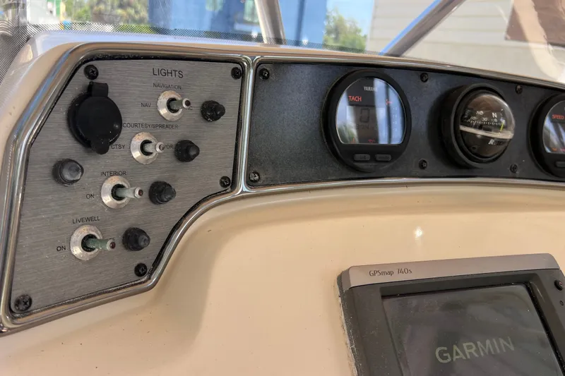 Slide: The Image of Control panel of a 2012 Scout 210 XSF boat with Garmin GPS and gauges. - 33