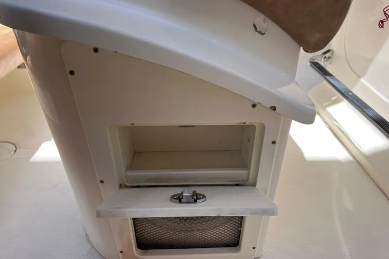 Slide: The Image of Storage compartment on a 2012 Scout 210 XSF boat interior. - 26