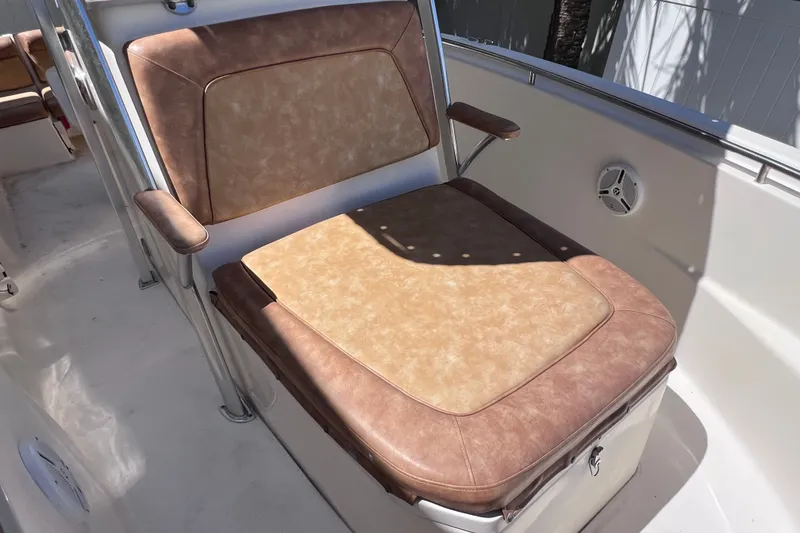 Slide: The Image of 2012 Scout 210 XSF boat seat with tan and brown upholstery. - 39
