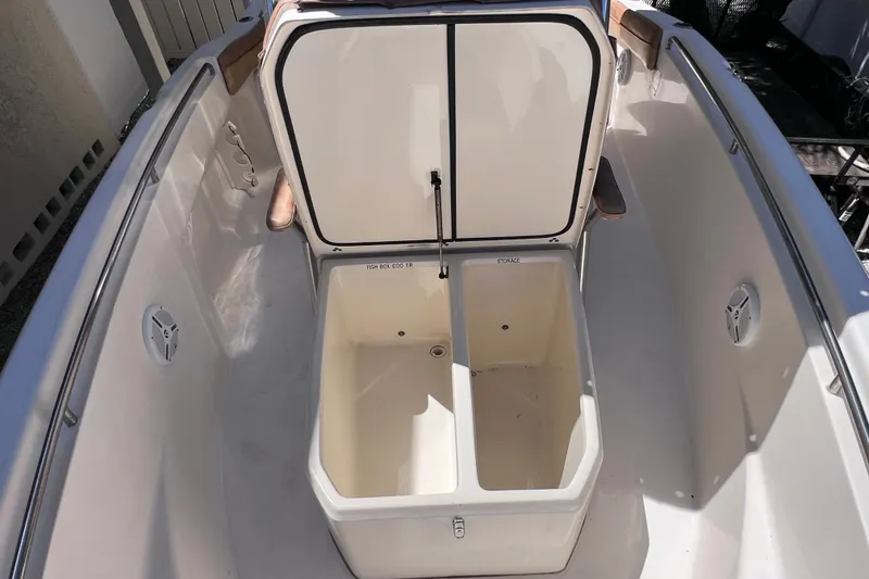 Slide: The Image of 2012 Scout 210 XSF boat interior with open storage compartments. - 41