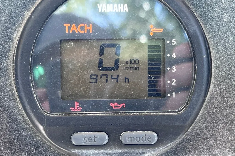 Slide: The Image of Yamaha tachometer displaying 974 hours on a 2012 Scout 210 XSF boat. - 30