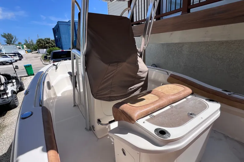 Slide: The Image of 2012 Scout 210 XSF boat interior with seating and console cover. - 20